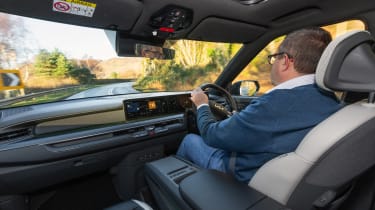 John McIlroy driving the Kia EV9